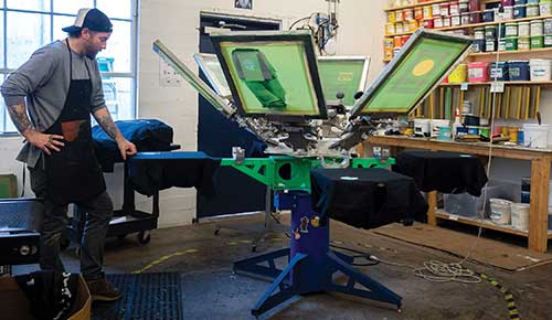  Youth gain paid work experience at the New Avenues INK screen printing shop, where they also learn how to advertise the items they make.