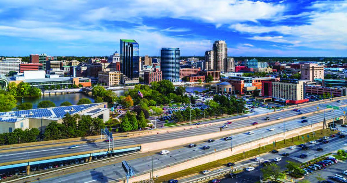 A view of downtown Grand Rapids with a highway in the foreground.