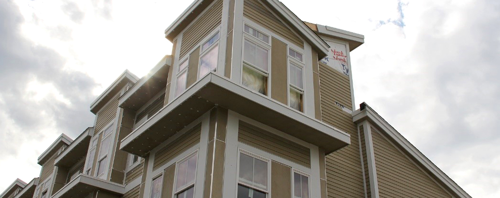 Photograph of the top two floors of a new residential building.