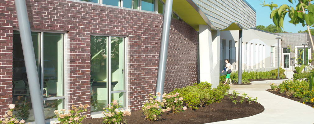 Photograph of the front façade of a one-story school building.