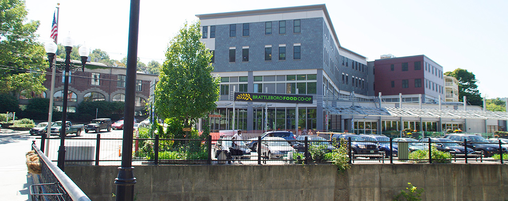 Photograph of a four-story mixed-use building.