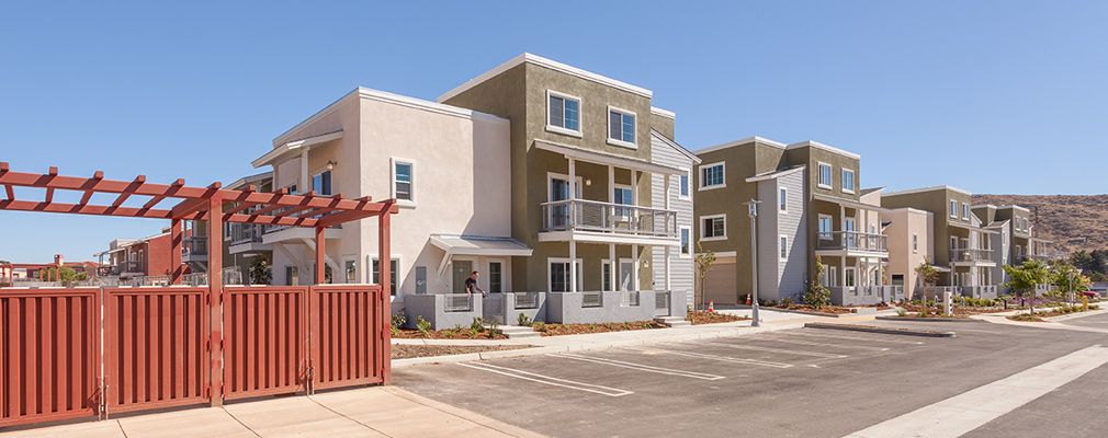 Photograph of seven overflow parking spaces in front of a townhouse. 