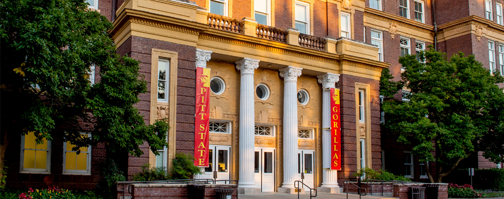 Photograph of the entrance to Russ Hall, a four-story academic building dating from 1908.