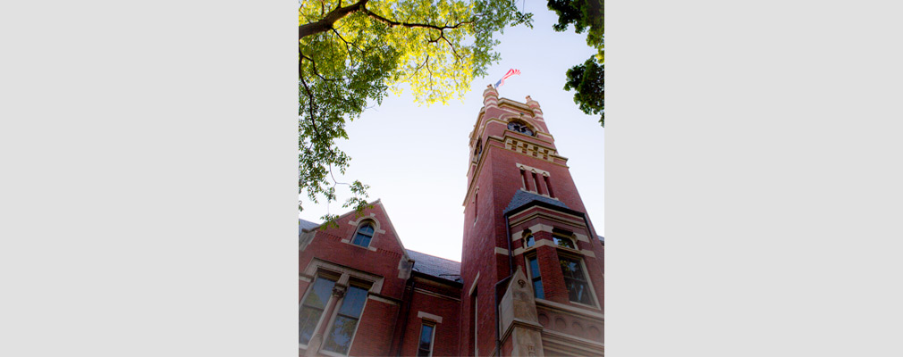 Photograph of a historic academic building with a tower (College Hall) at Smith College.