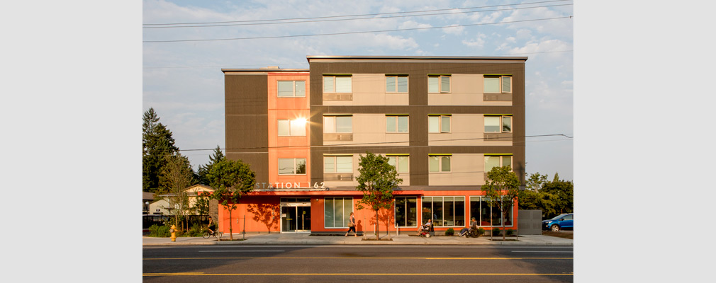 Photograph of the front façade of a four-story residential building.