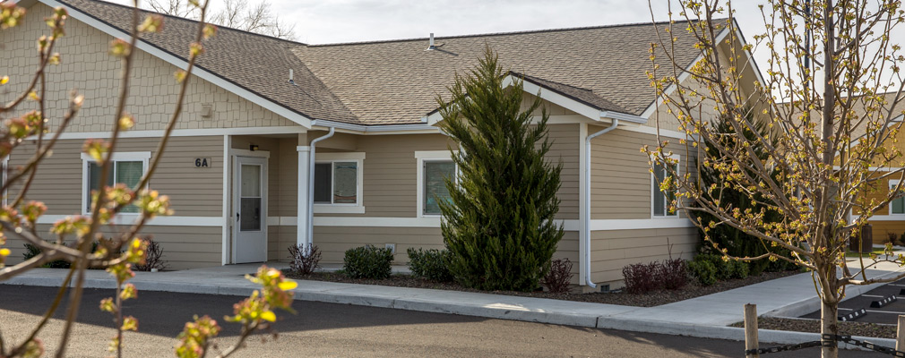 Photograph of a single-story duplex building.