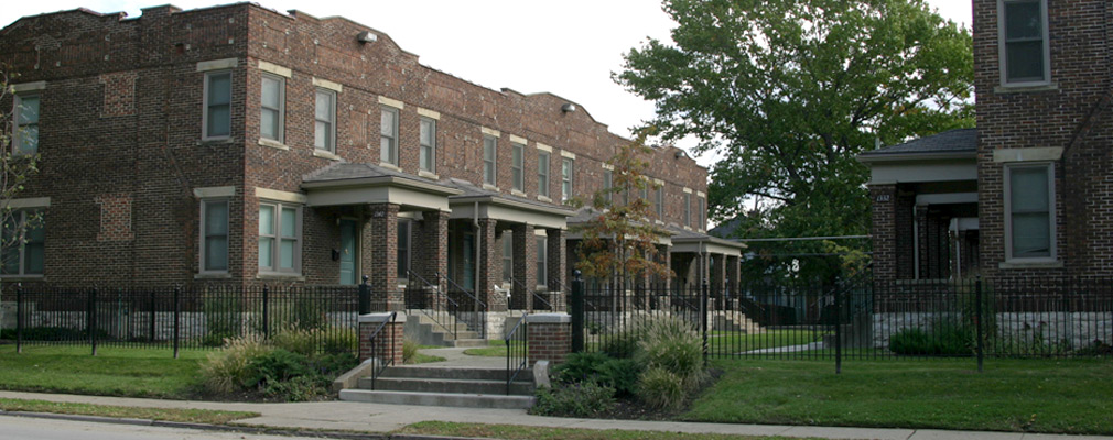 Photograph of several 2-story townhouses after being rehabilitated.