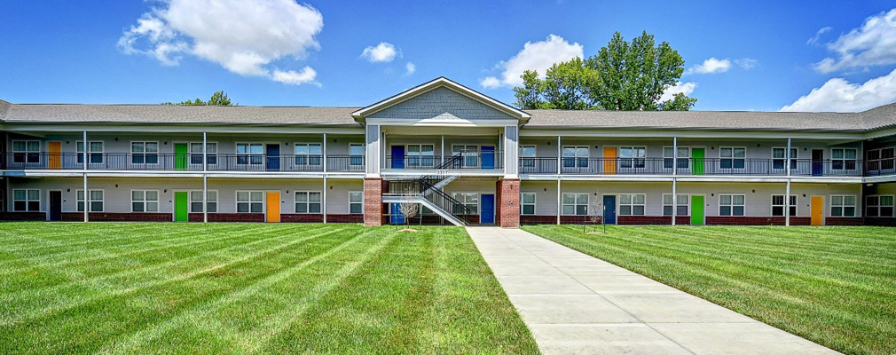 Photograph of the front façade of a two-story apartment building.