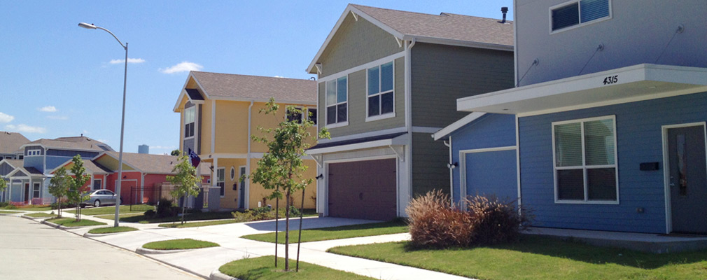 Photograph of the front façades of one- and two-story single-family detached houses.