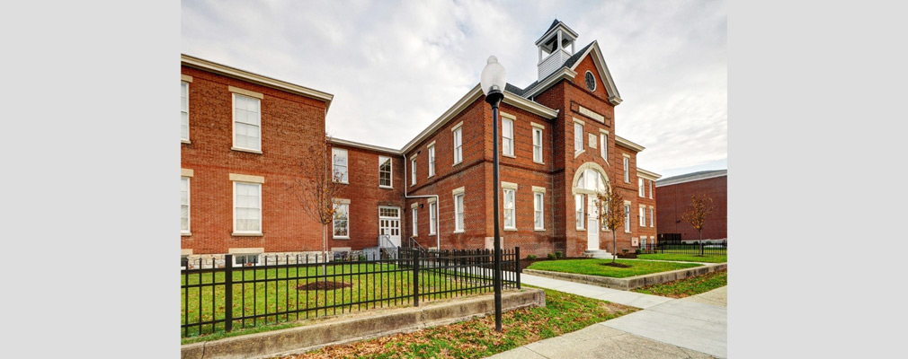 Photograph of the front façade of a two-story brick school building.