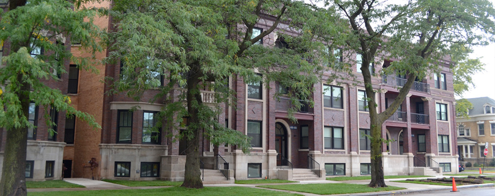 Photograph of a street façade of a multifamily building.