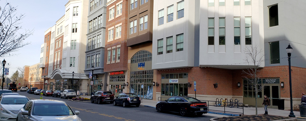 Photograph of a five-story mixed-use building.