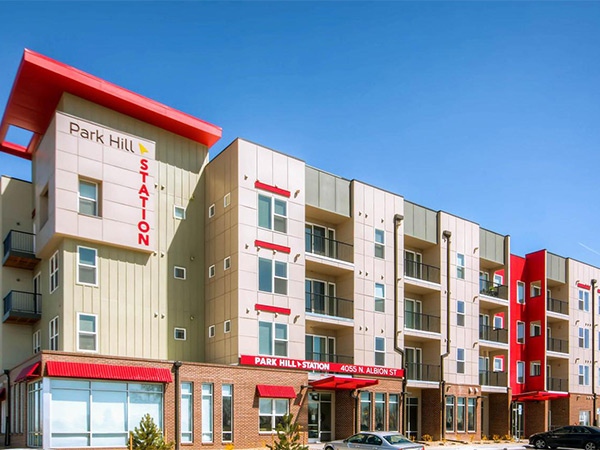 Photograph of a four-story apartment building.