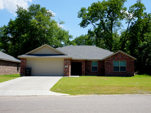 Photograph of the front façade of a one-story single-family detached house.