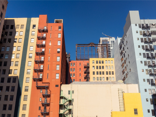 Image of several multistory apartment buildings. Image of several multistory apartment buildings.