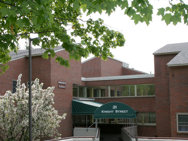 Image of Riverview Terrace, a three-story brick building, on 21 Knight Street in Westbrook, Maine.