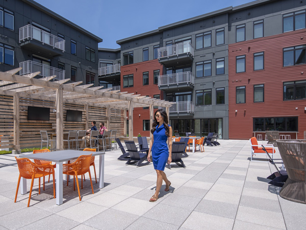 Photograph of an outdoor patio area with tables and seating.