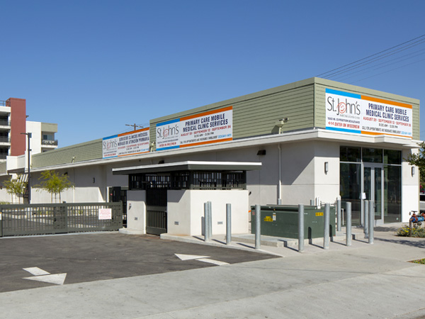 A one-story health care clinic with a parking area.