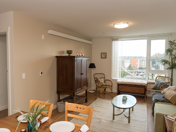 The dining area and living room of an apartment.