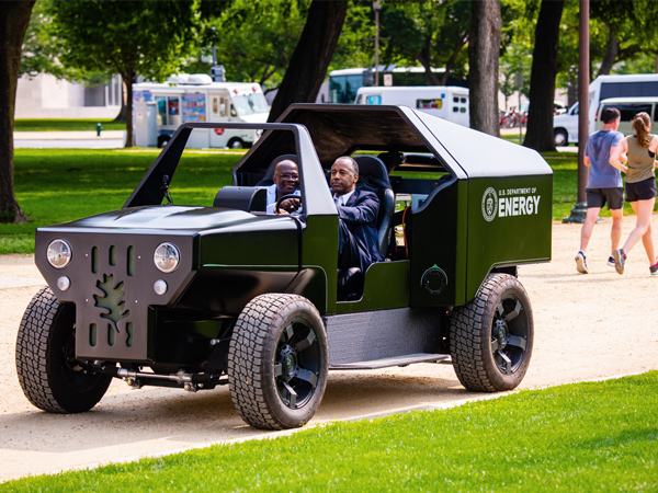 HUD Secretary Ben Carson drives a 3D-Printed Utility Vehicle along the National Mall in Washington, D.C.