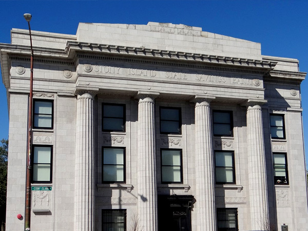 The Classical Revival Style Stony Island Trust & Savings Bank Building in Chicago, which has a “temple front” façade featuring large columns.