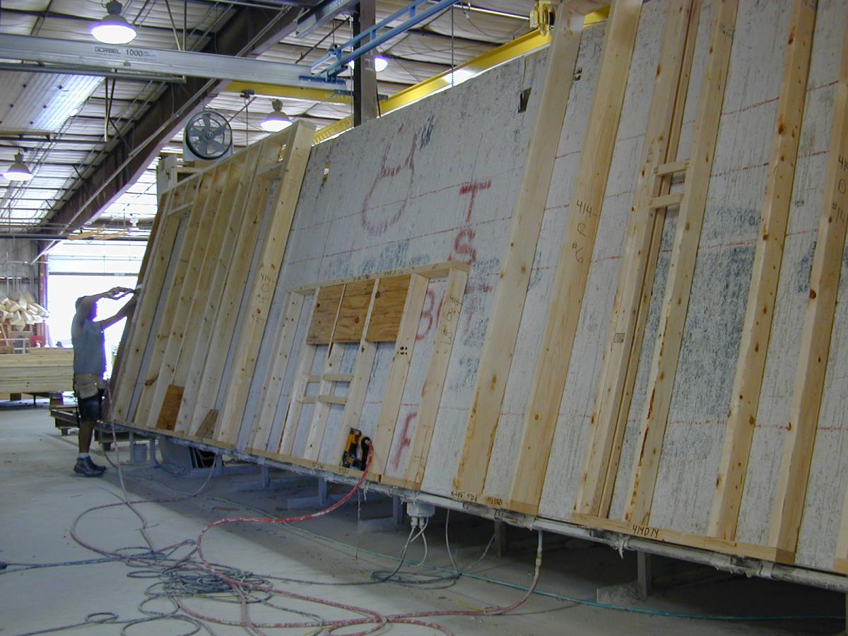 Photograph of a wall panel with visible wood framing.