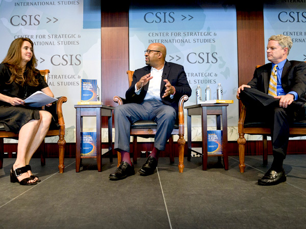 Michele Jolin, CEO and co-founder of Results for America, moderates a discussion between Michael Nutter and John Bridgeland, who are sitting on stage during the event at the Center for Strategic and International Studies. 