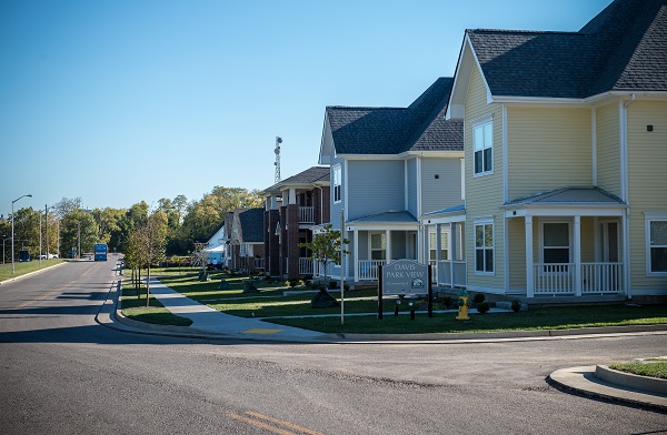 Photograph of five houses completed in the project’s first phase.