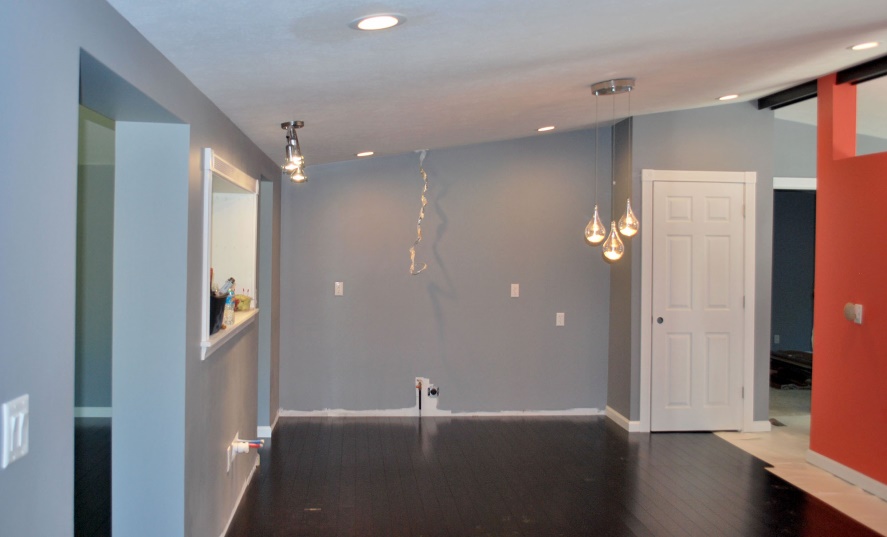 Photograph of an unfurnished dining room.