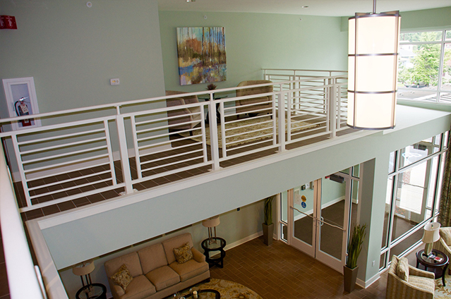 Photograph of the entryway to the renovated building taken from the mezzanine above the lobby.