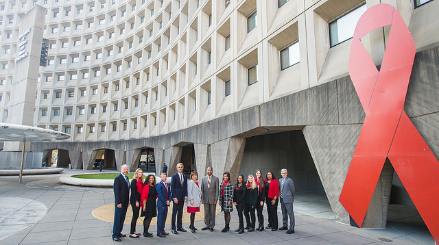 Secretary Carson and HOPWA with Word Aids Day Ribbon