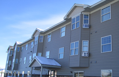 Photograph of the front façade of a three-story residential building.