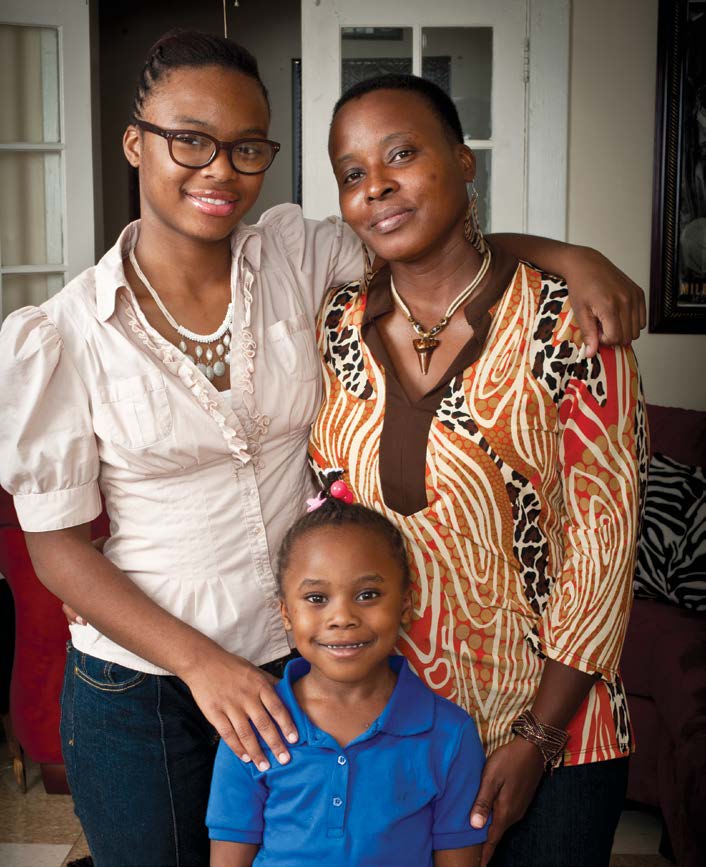 Photo showing a mother and her two daughters.