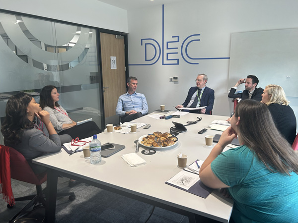 Group meeting around a conference table.