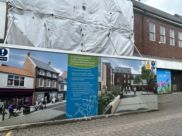 Two-story building in the process of being renovated.