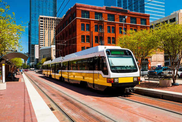 A light rail train at a station.