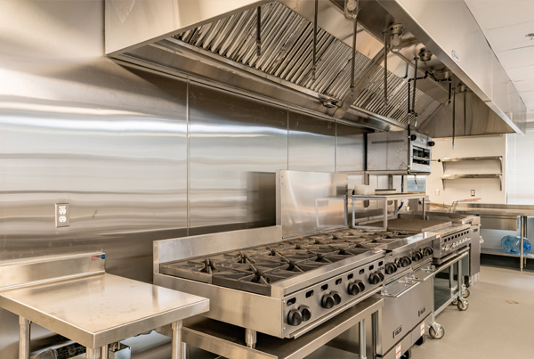 Stoves and griddle in a commercial kitchen.