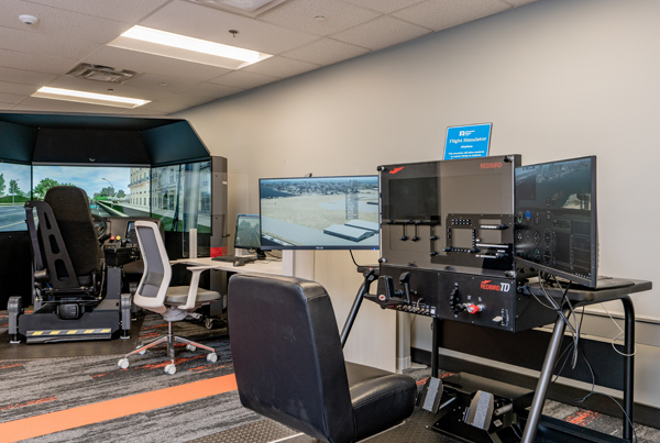 A computer room with large monitors.