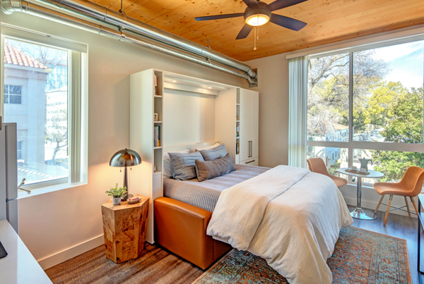 A Murphy bed in a small modern apartment.