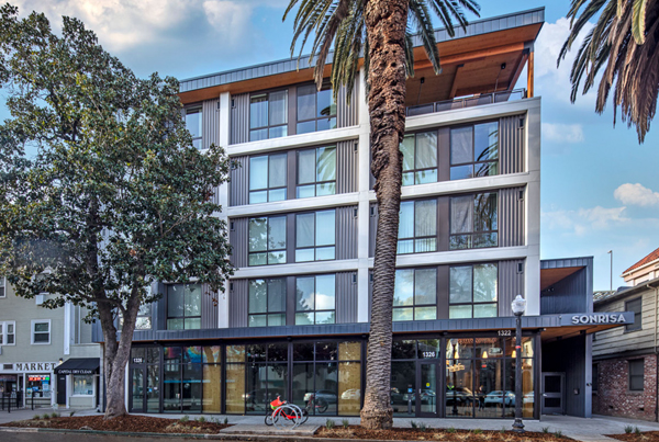 Exterior image of a five-story modern apartment building.