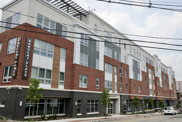 A corner view of a low-rise apartment building.