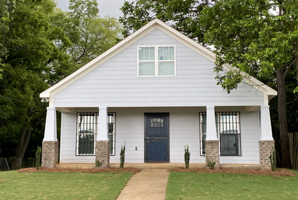 Single-family house with a front lawn and a walkway to the front door.