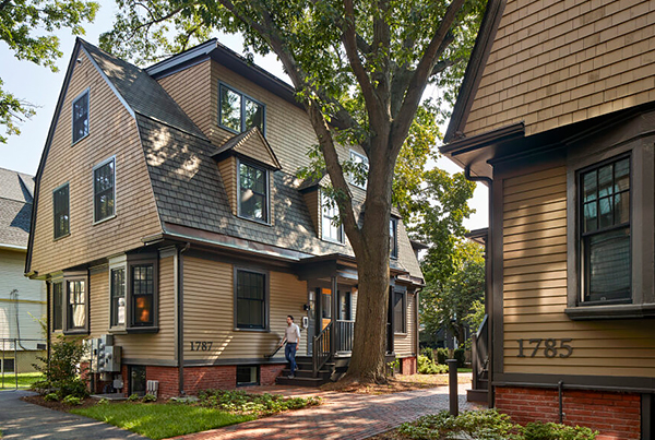 Two early 1900s shingle-style cottages.