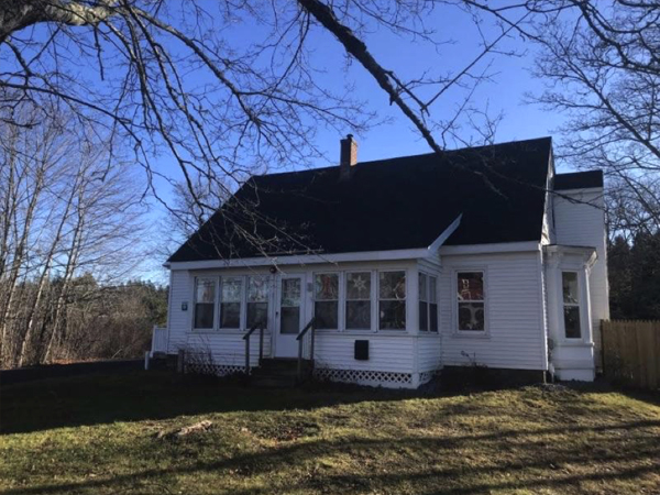  Image of a gabled single-story white clapboard house.