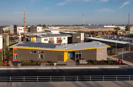 An apartment complex with solar panels on the roofs.