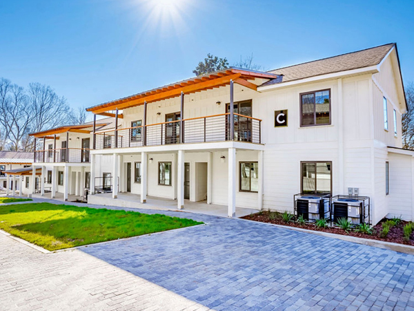 Photograph of modern two story residential buildings.