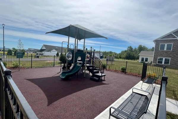 Outdoor playground with benches.