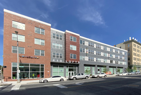 Photo of the side of a four-story residential building.