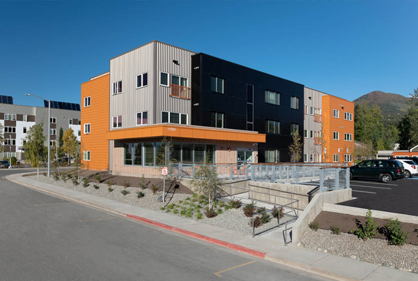 Exterior of a three-story apartment building.