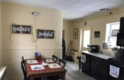  Image of a kitchen with kitchen table.